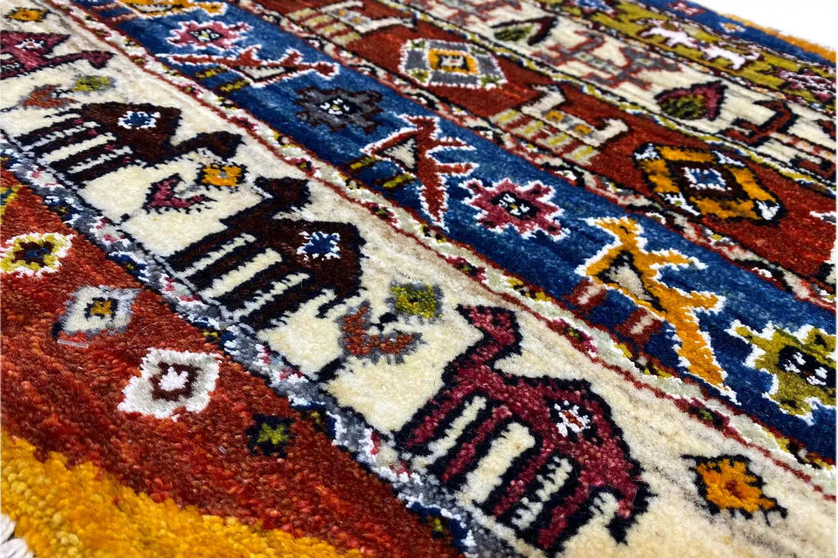 Close-up of a Gabbeh-Lori rug (58x56 cm) with a dense multicolored pattern