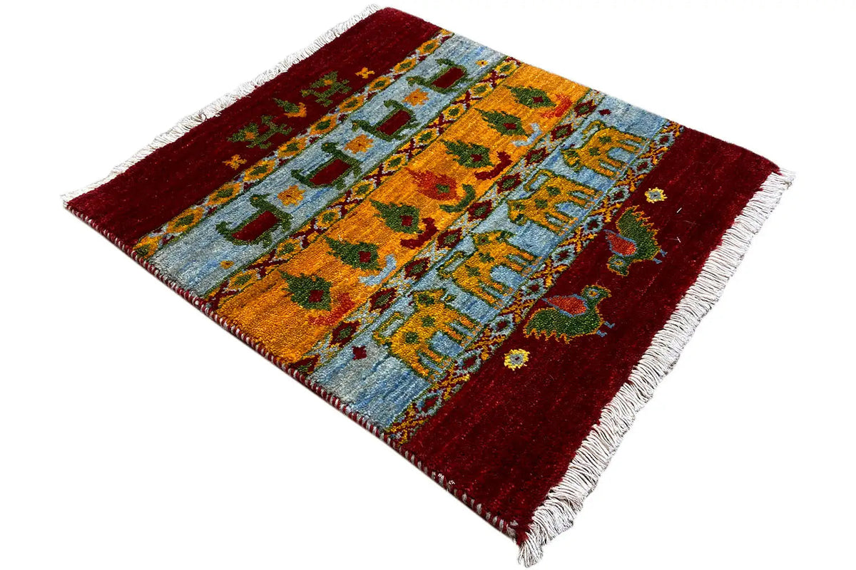Gabbeh Lori rug 61x58 cm angled: patterned in red, blue, and yellow with fringes