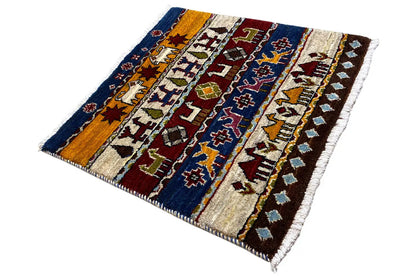 Gabbeh Lori rug 60x58 cm, photographed at an angle, with ornamental rows and fringes