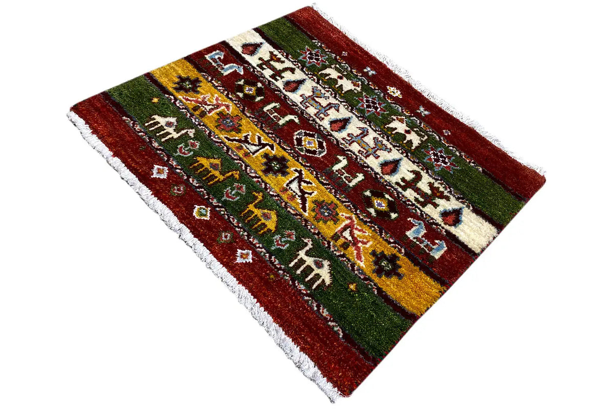 Gabbeh-Lori rug, 55x64 cm: shown at an angle, red-green-yellow stripes with figures