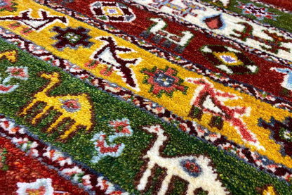 Gabbeh-Lori rug, 55x64 cm: close-up of the colorful pattern with animals and diamonds