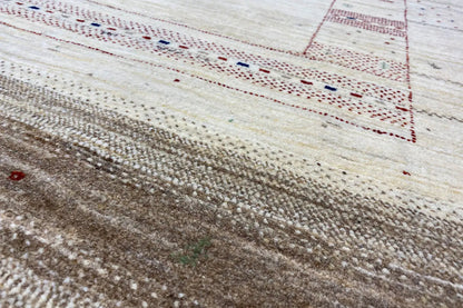Details of Lori Gabbeh rug: dense pile with brown areas and red/blue accents