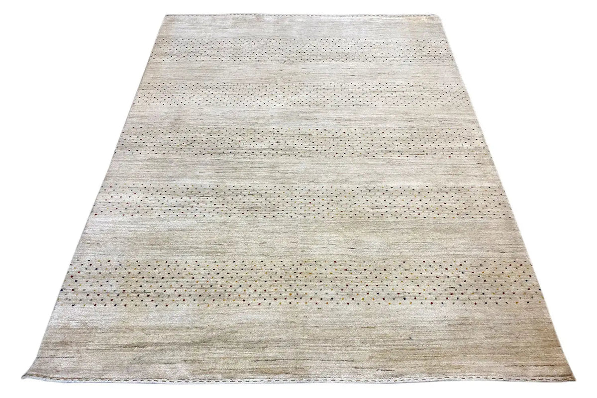 Gabbeh rug with an elongated appearance and a delicate striped pattern in light beige