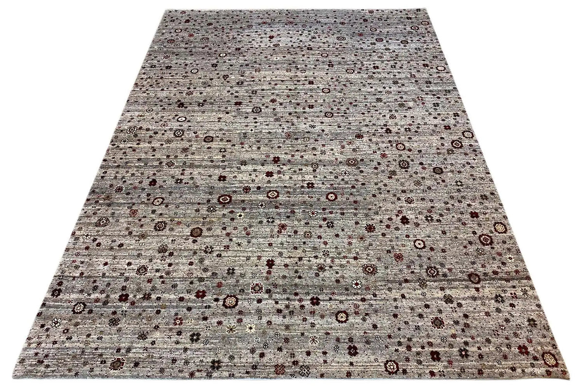 Gabbeh-Lori rug in grayish brown, spread out, with a small ornamental pattern and dark red dots