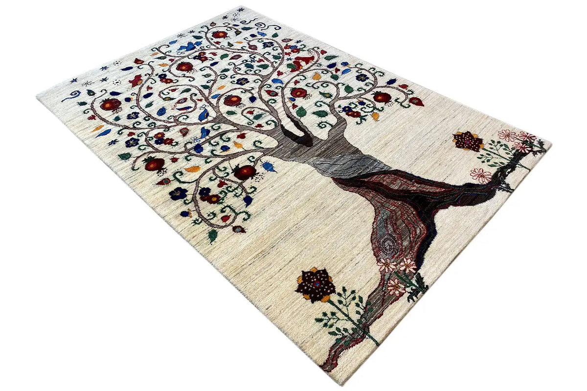Gabbeh rug with a tree trunk and delicate floral patterns, cream-colored, colorful accents