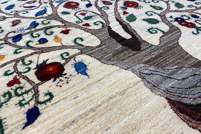 Carpet detail: tree ornament and floral motifs, cream-colored pile with colorful threads