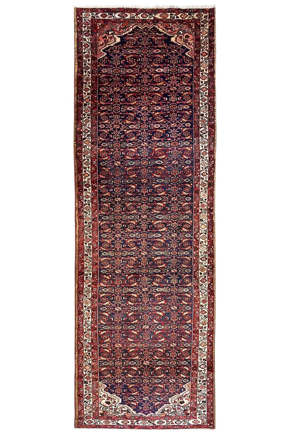 Portrait-oriented Oriental rug runner with a dark red and blue pattern and a border all around.