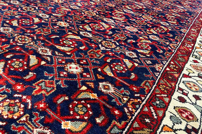Hamadan runner close-up: blue field with red accents, white and gold ornaments