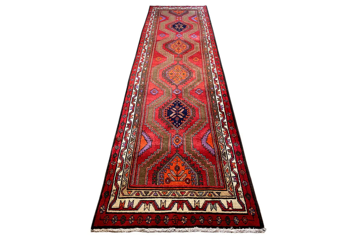 Elongated Hamadan runner: red geometric pattern with a central medallion and border