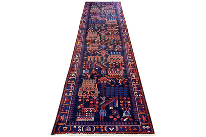 Long runner rug with a dark pattern, decorative border, and surrounding ornaments