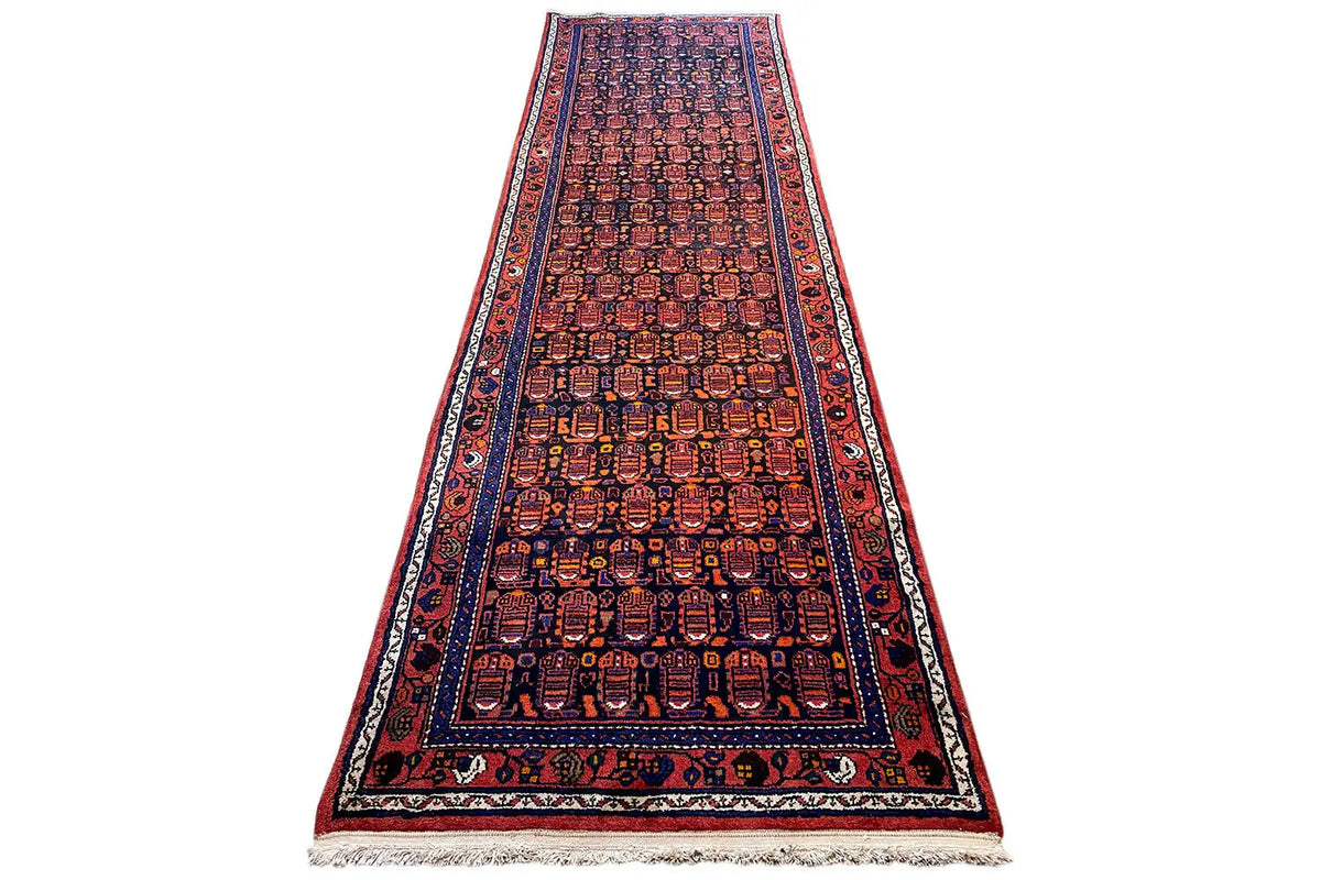 Hamadan runner: long central band with a geometric pattern in dark red and blue