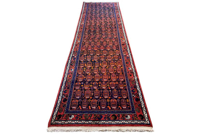 Hamadan runner: long central band with a geometric pattern in dark red and blue
