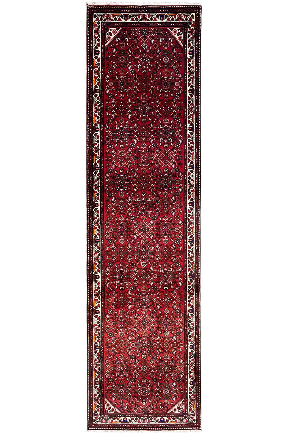 Narrow red runner with a framed border, central ornamental panel, and outlined corners