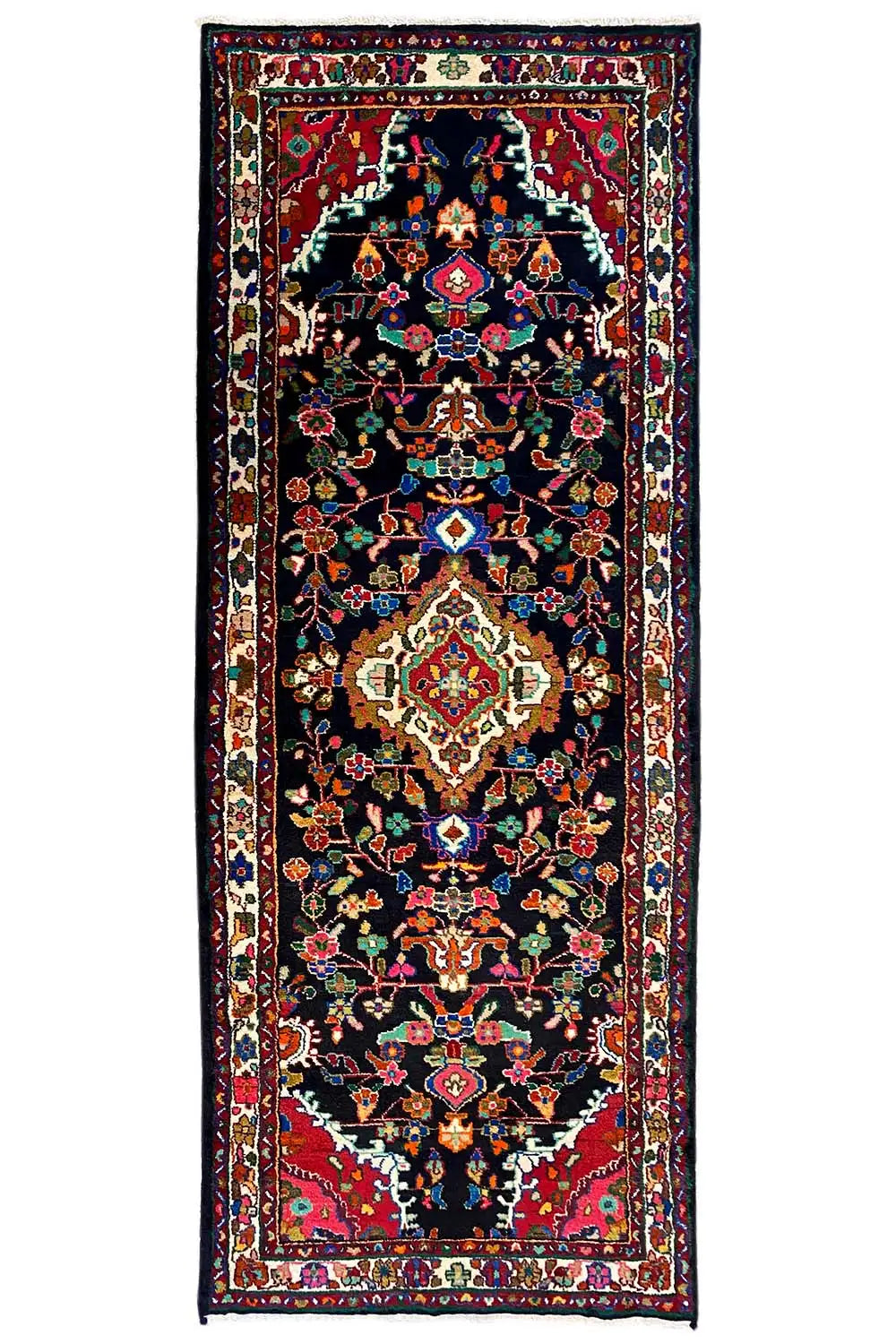 Oriental runner rug with a dark background and floral medallions, bordered