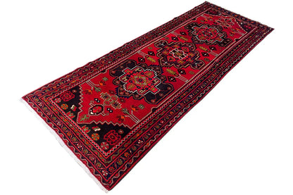 Hamadan runner with a red ground, finely patterned border, and clear diagonal ornaments
