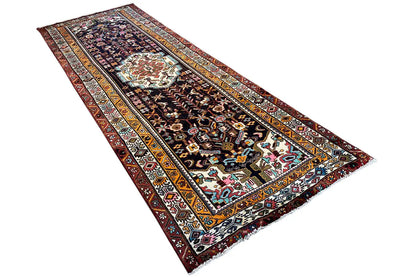 Oriental rug runner laid diagonally, geometric pattern with colored border stripes