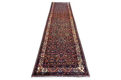 Long, narrow runner: bold ornamental pattern with a multicolored border on a dark background