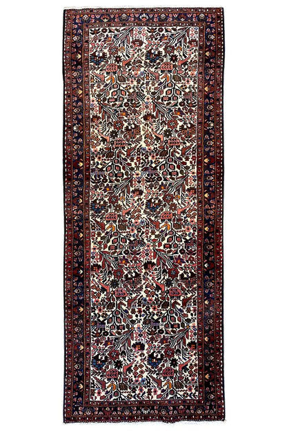 Runner rug (295x109 cm) with an overall rectangular design, dark border and ornamentation