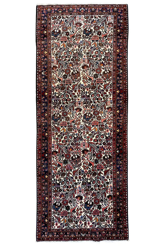 Runner rug (295x109 cm) with an overall rectangular design, dark border and ornamentation