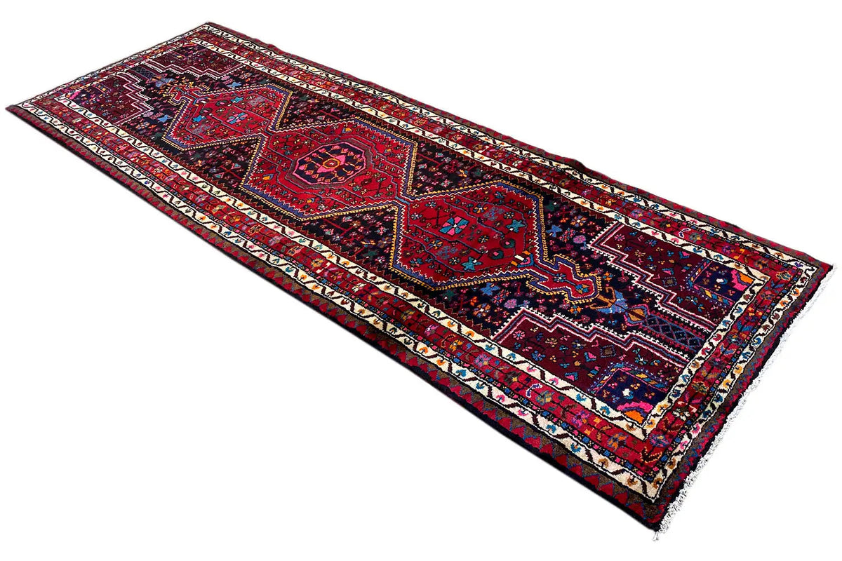 Hamadan runner laid flat, geometric ornaments in dark blue and red