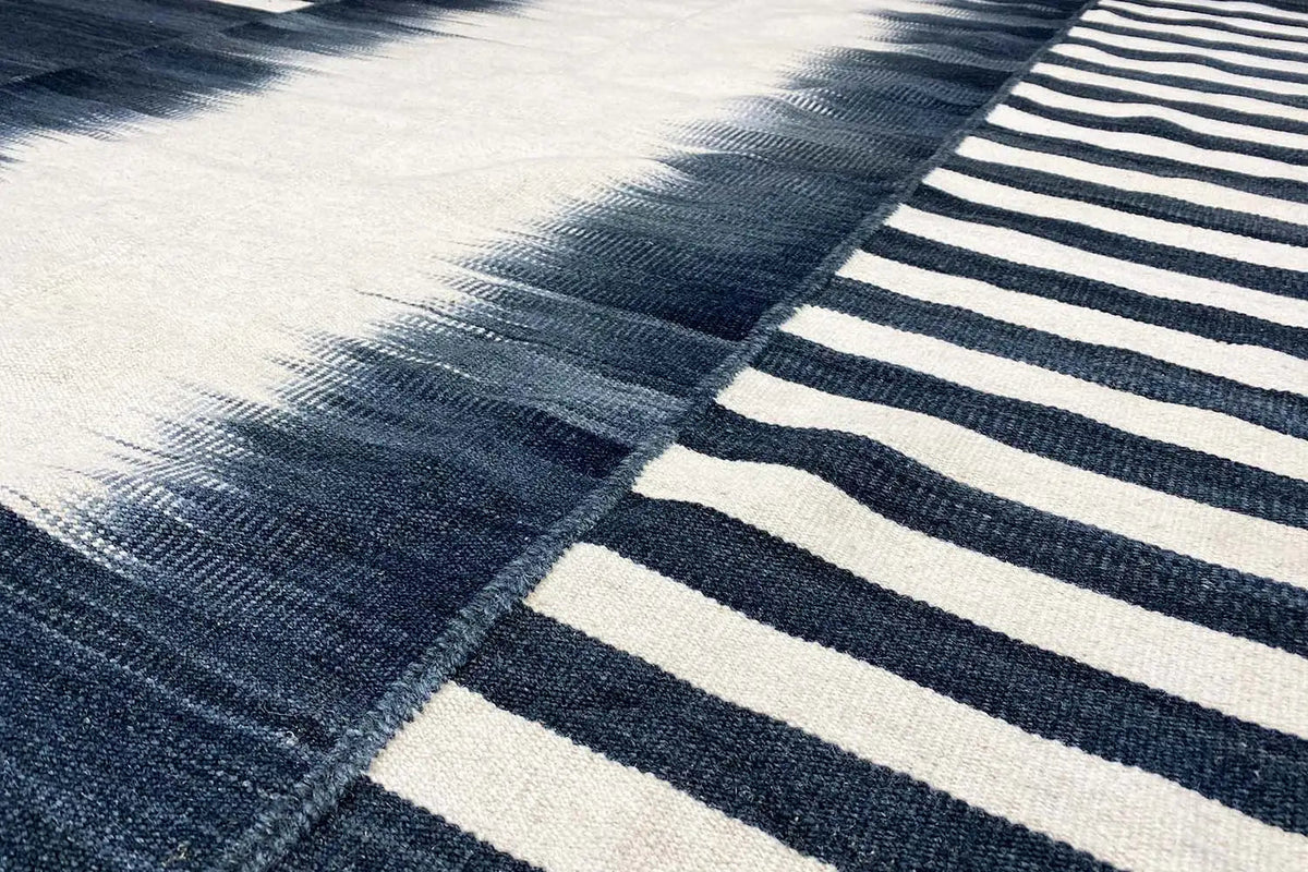 Modern kilim (170x240 cm) with dark blue and white stripes and woven sections
