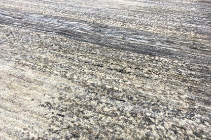 Gabbeh Lori rug: patterned pile in beige, gray, and dark gray, close-up