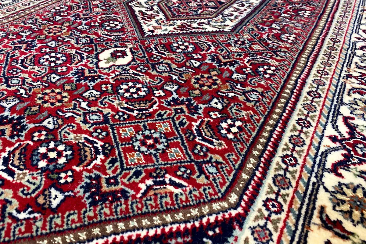 Close-up of a Bidjar rug with a border and ornamental pattern