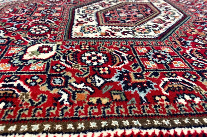 Bidjar rug (93x61 cm) with detailed pattern in red, blue, and white, close-up view