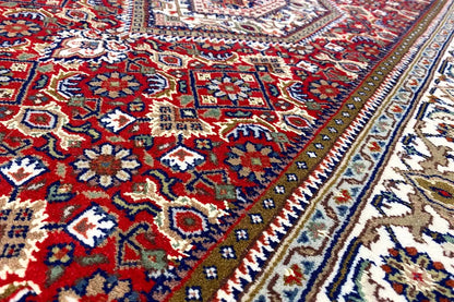 Bidjar runner with geometric patterns in blue, red, beige, and a decorative border.