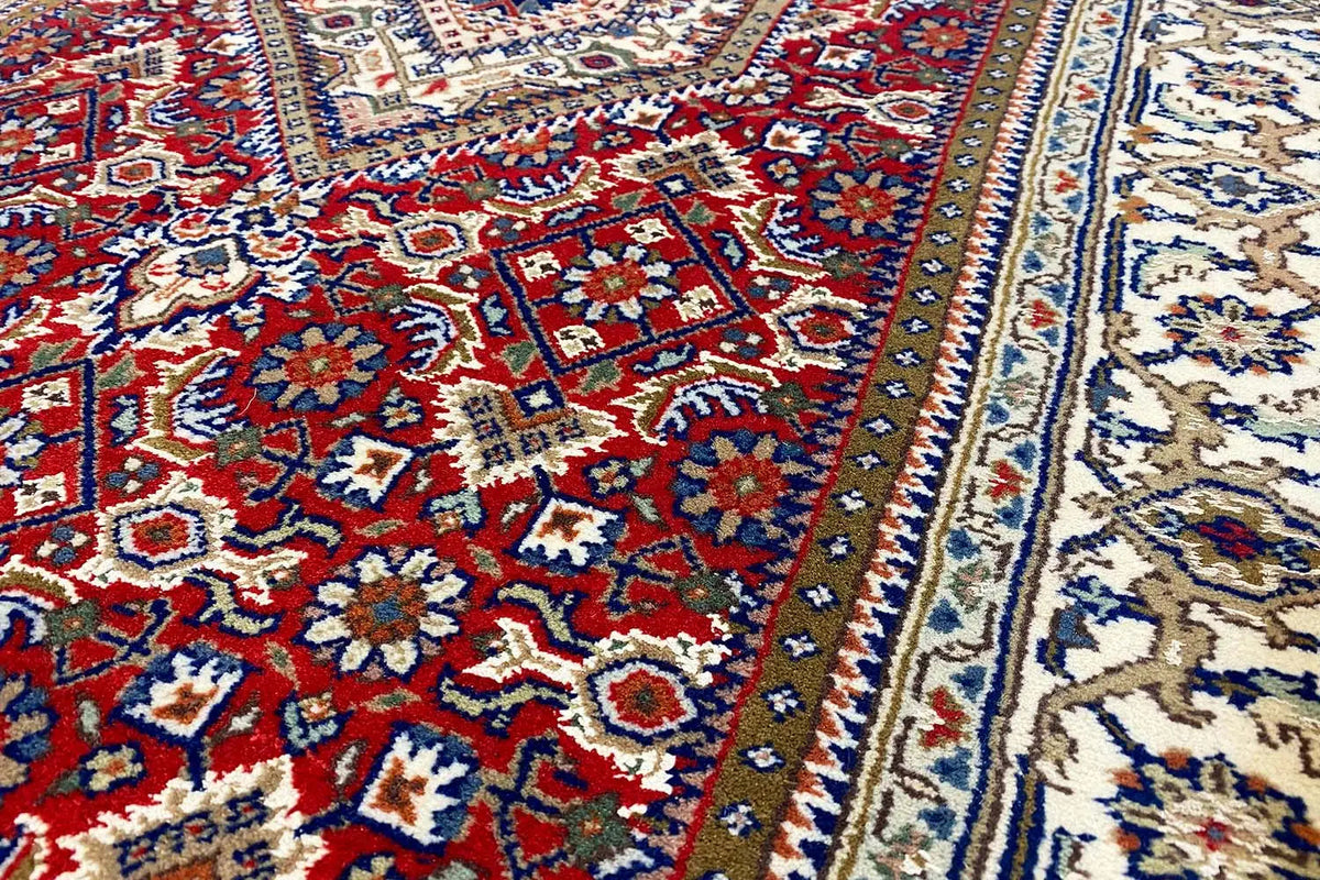 Bidjar runner with a red background and blue-and-white ornaments, detailed border