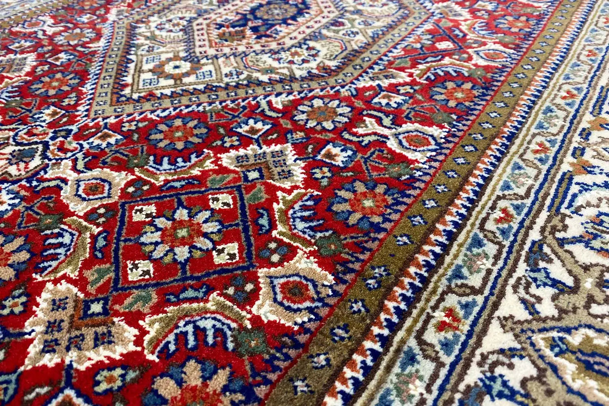 Close-up of a Bidjar runner: detailed pattern in red, blue, and beige with a border