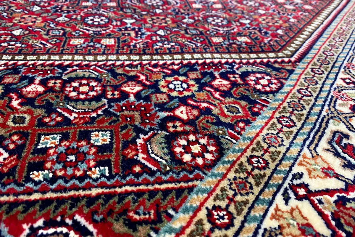 Bidjar rug with a detailed red field of ornaments and a multicolored border