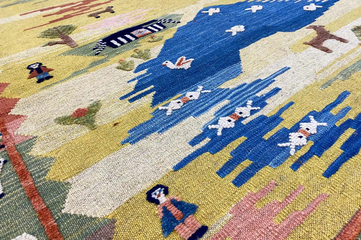 Kilim pattern with stylized figures and mountains in blue, yellow, and red