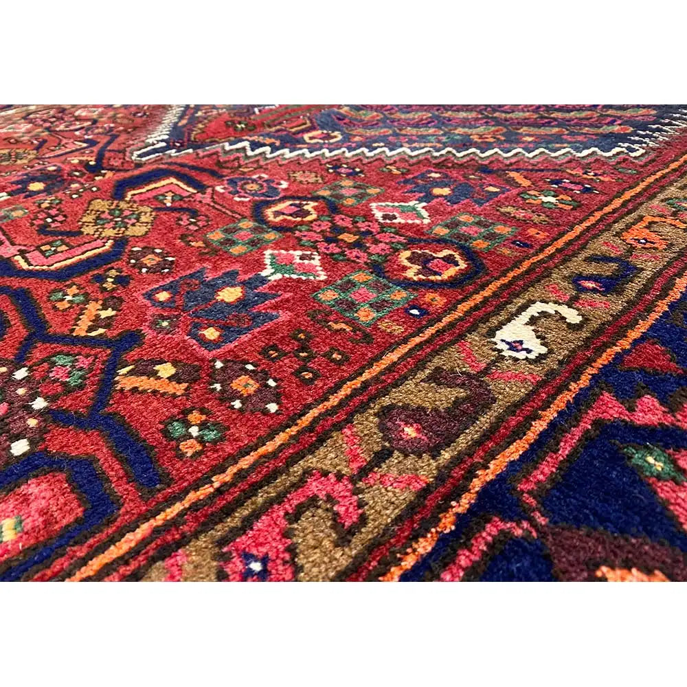 Hamadan rug with red, blue, and multicolored ornamental pattern, border