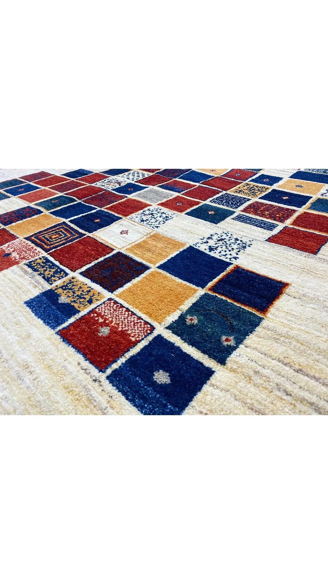 Gabbeh rug with a checked pattern in blue, red, and cream