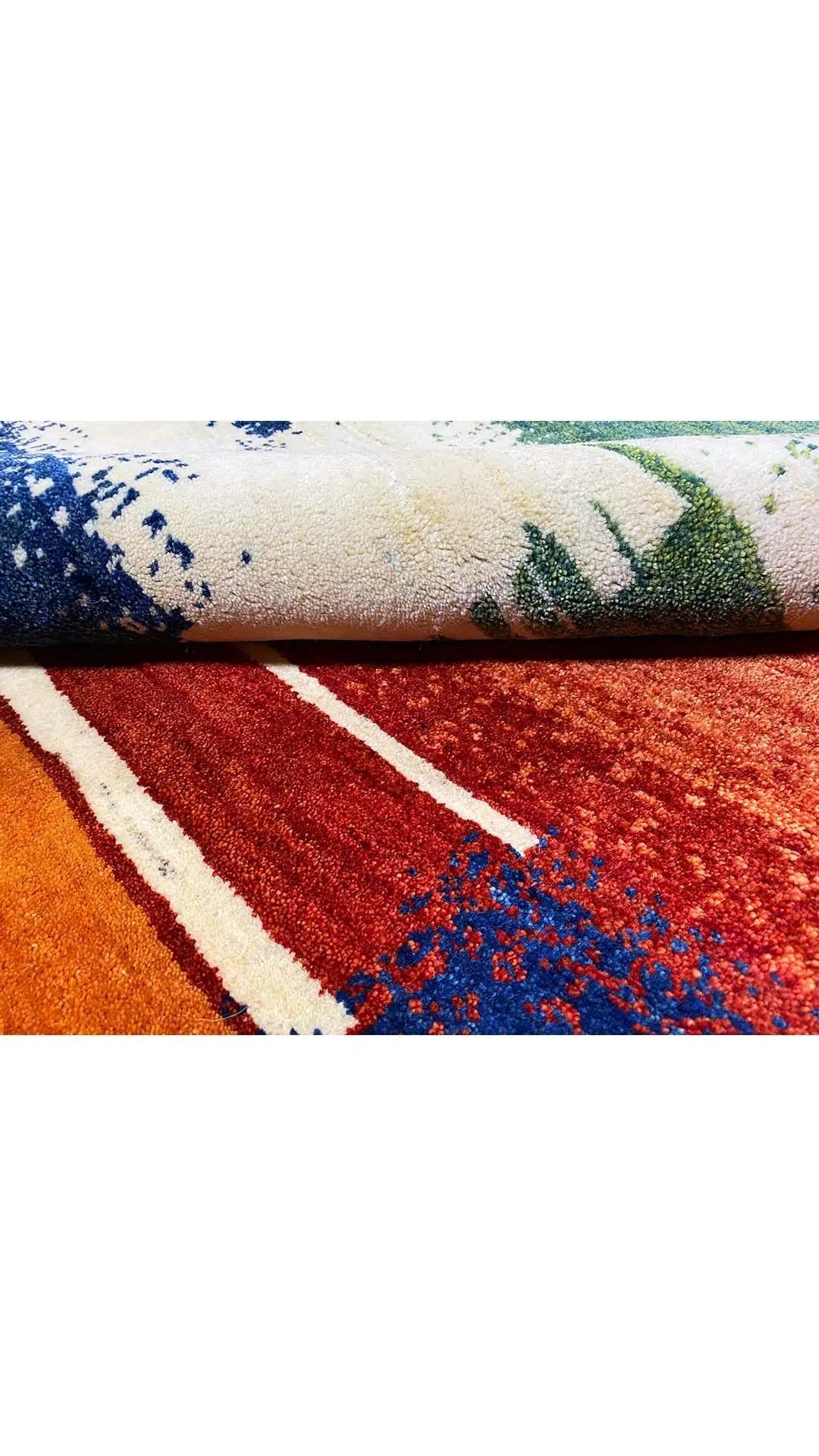 Gabbeh rug detail: multicolored stripes and dots, visible border