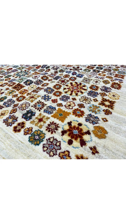 Gabbeh rug 198x148 cm: cream-colored rug with a colorful floral pattern