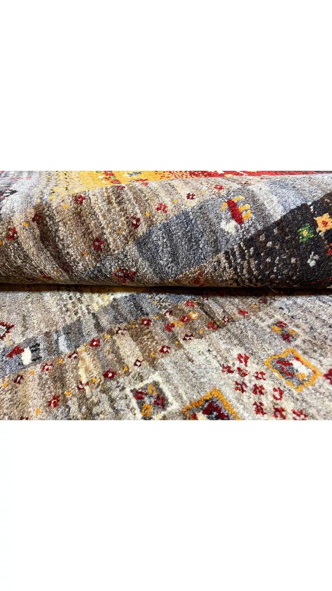Rug surface with a Gabbeh pattern: gray base with colorful, small pattern dots