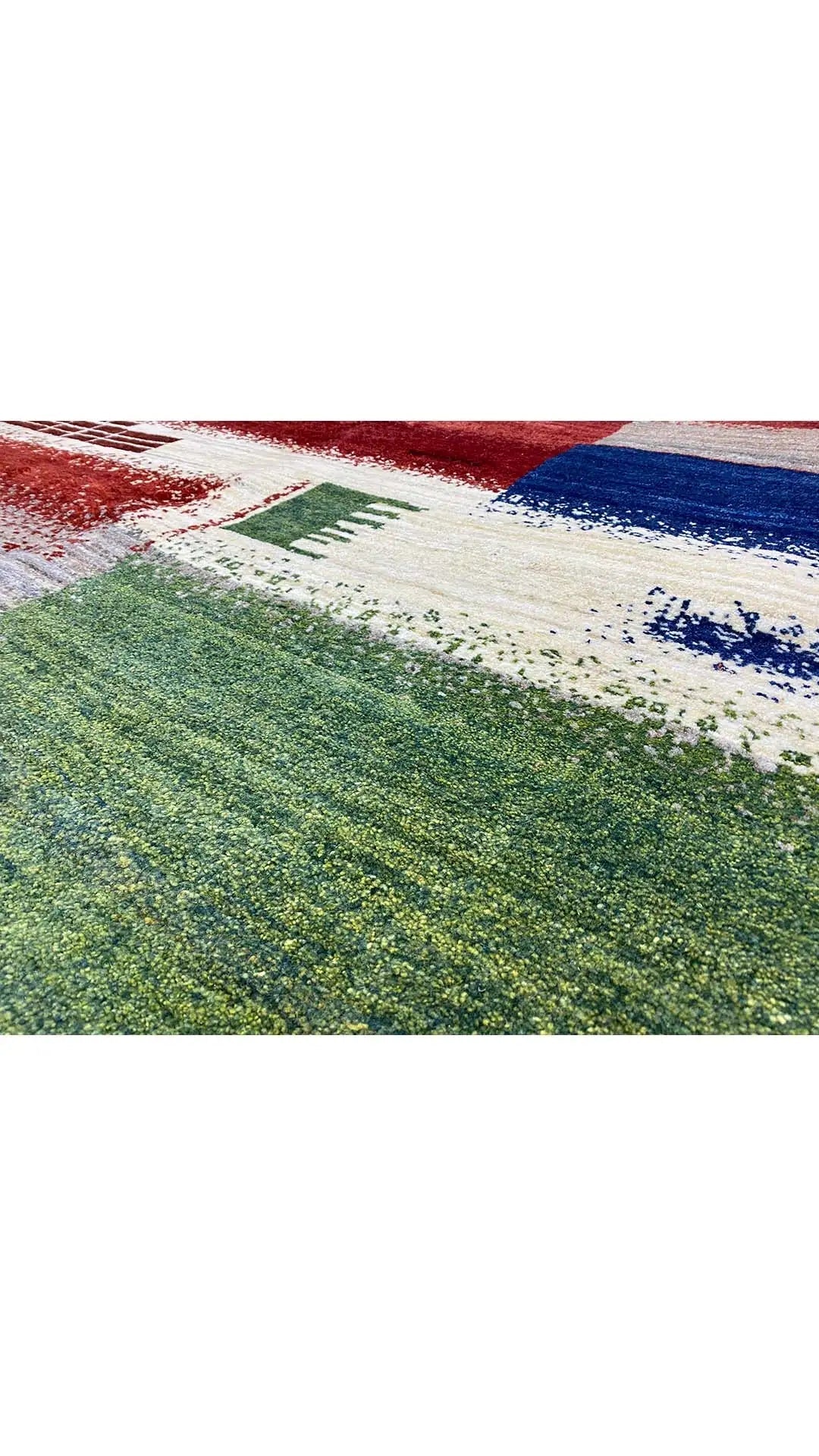 Gabbeh rug (198x150 cm) with an abstract pattern in green, red, blue, and beige