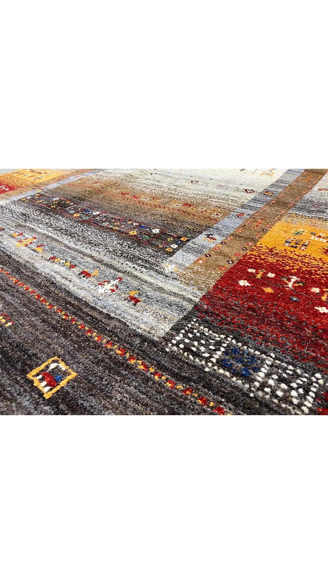 Gabbeh rug, geometric pattern with multicolored border, dark background