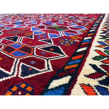 Shiraz rug with a red block pattern and multicolored geometric motifs