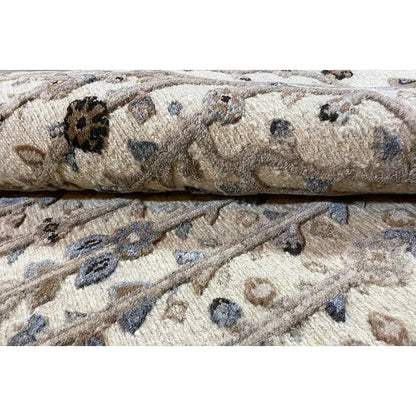 Carpet border with a twisted edge; light gray pile with dark, irregular ornaments