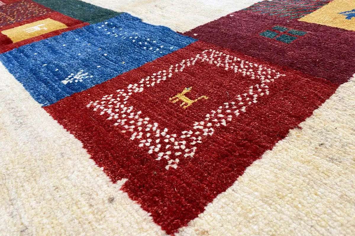 Gabbeh rug 305x200 cm, close-up: red and blue geometric pattern