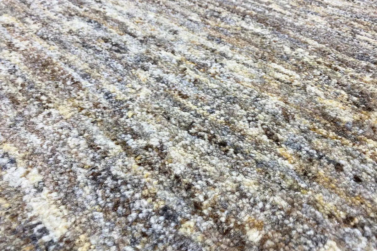 Gabbeh rug: mottled low-pile pattern in beige, gray, and brown