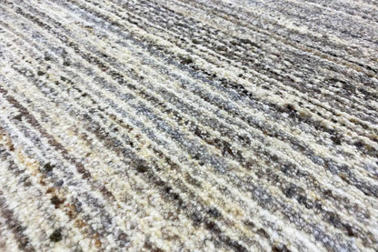 Gabbeh rug: beige pile with brown-grey longitudinal stripes and dark dots