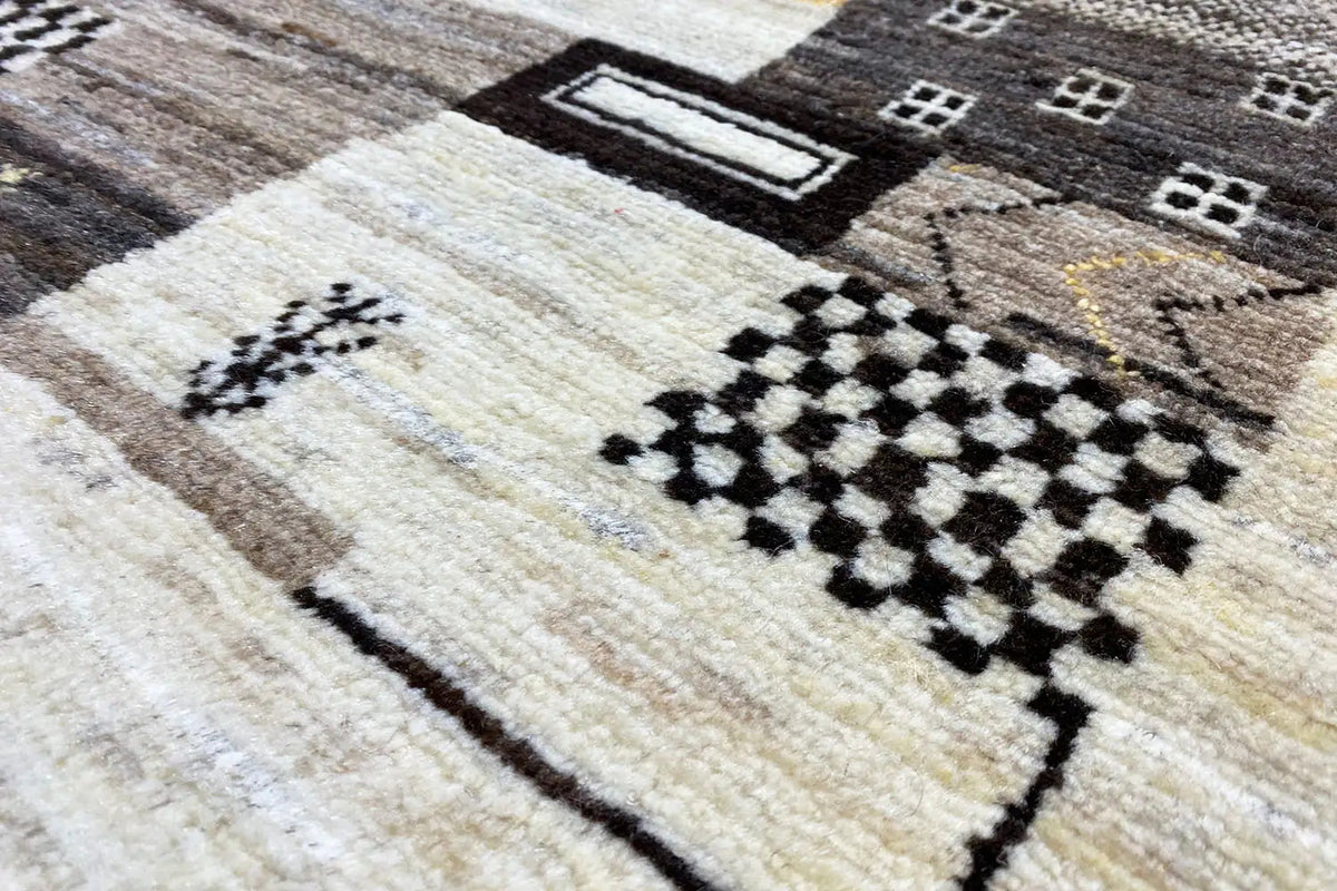 Gabbeh rug with a light background and black diamond and square pattern