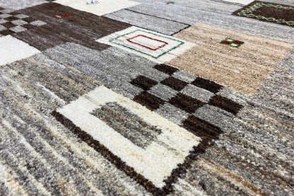 Gabbeh rug, rectangular, gray-beige with a patchwork pattern and color accents