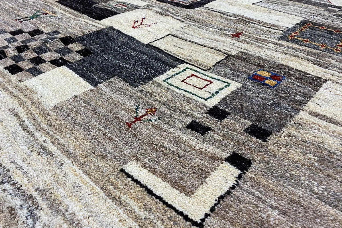Gabbeh rug with a geometric pattern in beige, gray, and black