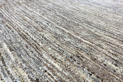 Gabbeh rug, close-up with mottled vertical stripes in gray and beige