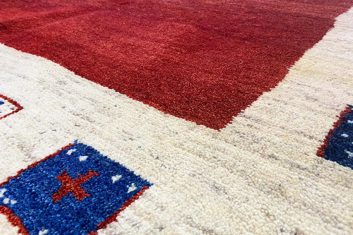 Gabbeh rug 297x202 cm, detail: red geometric pattern with blue cross